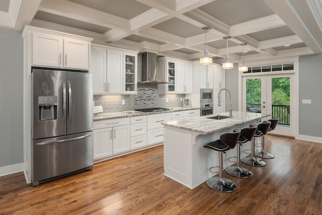 114 Monroe Dr, Ringgold, GA 30736 - kitchen featuring appliances with stainless steel finishes, a sink, white cabinets, wall chimney exhaust hood, and beam ceiling