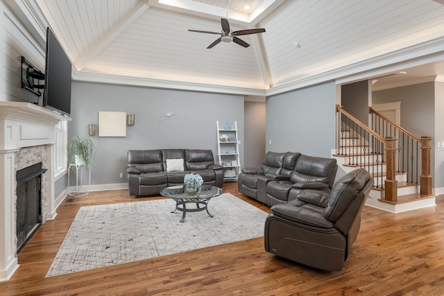114 Monroe Dr, Ringgold, GA 30736 - living area featuring a ceiling fan, stairway, wood finished floors, a fireplace, and baseboards