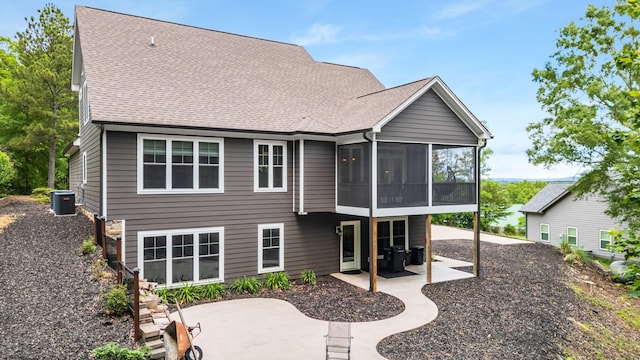 114 Monroe Dr, Ringgold, GA 30736 - rear view of house featuring a patio area, a sunroom, central AC unit, and a shingled roof