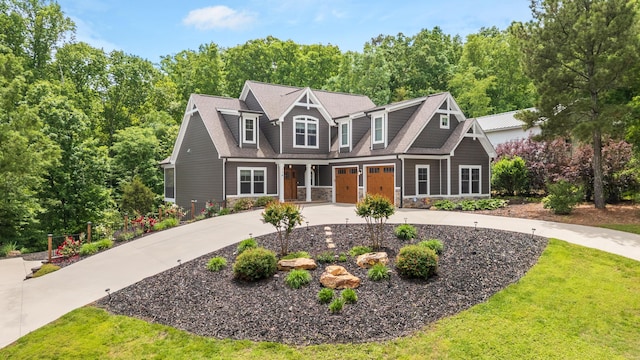 114 Monroe Dr, Ringgold, GA 30736 - view of front of property featuring curved driveway, an attached garage, stone siding, and a front lawn