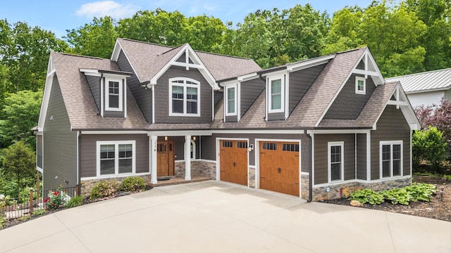 114 Monroe Dr, Ringgold, GA 30736 - view of front of home featuring stone siding, concrete driveway, roof with shingles, and fence