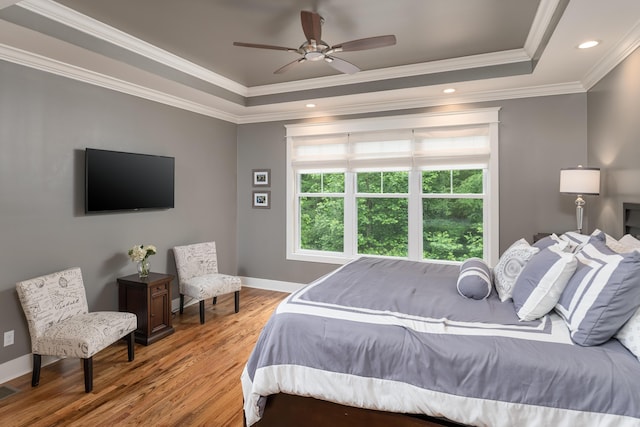 114 Monroe Dr, Ringgold, GA 30736 - bedroom featuring a tray ceiling, wood finished floors, ornamental molding, baseboards, and ceiling fan
