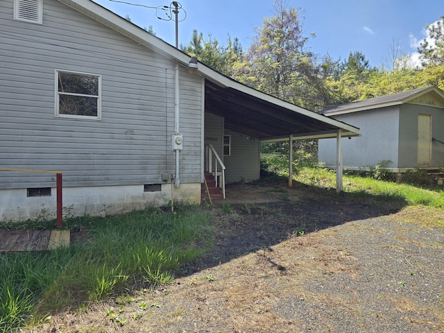 138 Singo Dr, Turtletown, TN 37391 - view of side of property with entry steps, crawl space, a carport, and driveway