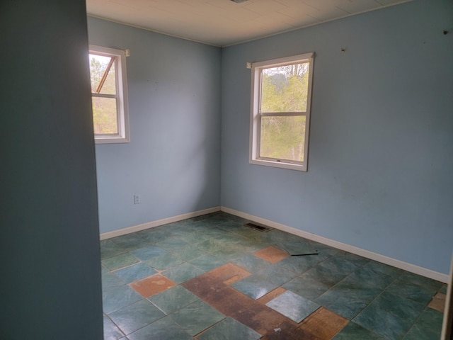 138 Singo Dr, Turtletown, TN 37391 - empty room featuring stone finish flooring and baseboards