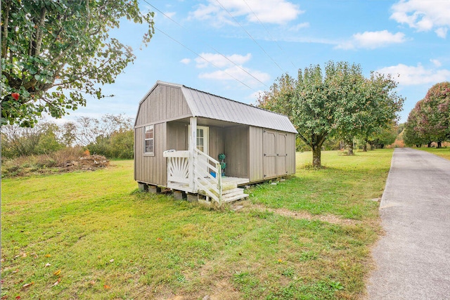 view of outdoor structure featuring a lawn