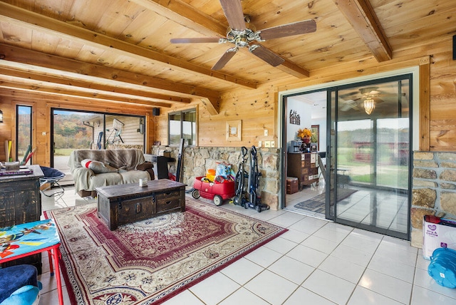 living room with light tile patterned flooring, beamed ceiling, and wood ceiling