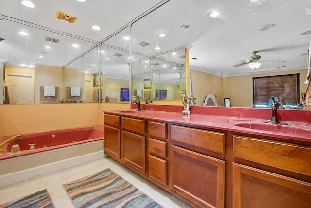 bathroom with a bathing tub, ceiling fan, crown molding, and vanity