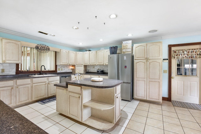 kitchen featuring a center island, light tile patterned flooring, stainless steel appliances, and sink