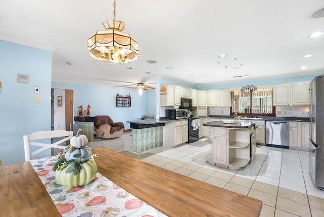 tiled dining area featuring ceiling fan with notable chandelier and crown molding