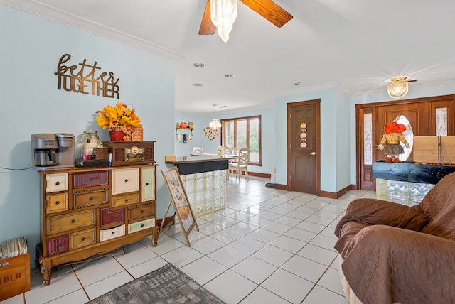 living room with light tile patterned floors, ceiling fan, and crown molding