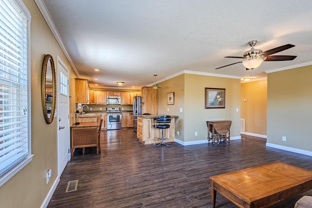 living room featuring crown molding, dark hardwood / wood-style flooring, sink, and a textured ceiling