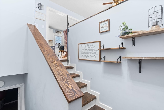 staircase with ceiling fan