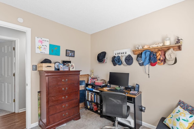 office area featuring carpet floors and baseboards