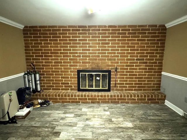 details with ornamental molding, a fireplace, and wood finished floors