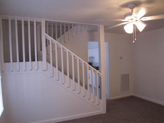 stairs with baseboards, visible vents, and carpet flooring