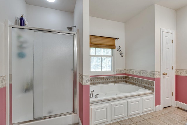 bathroom featuring tile patterned flooring, a stall shower, a garden tub, and visible vents