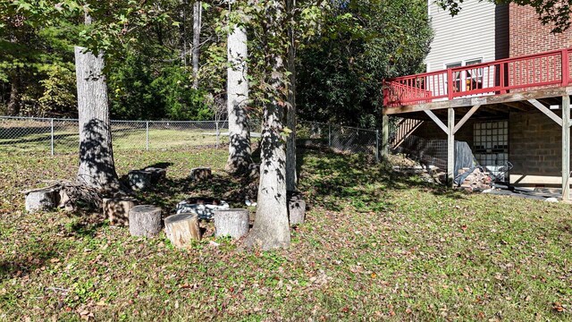 view of yard with a fenced backyard and a deck