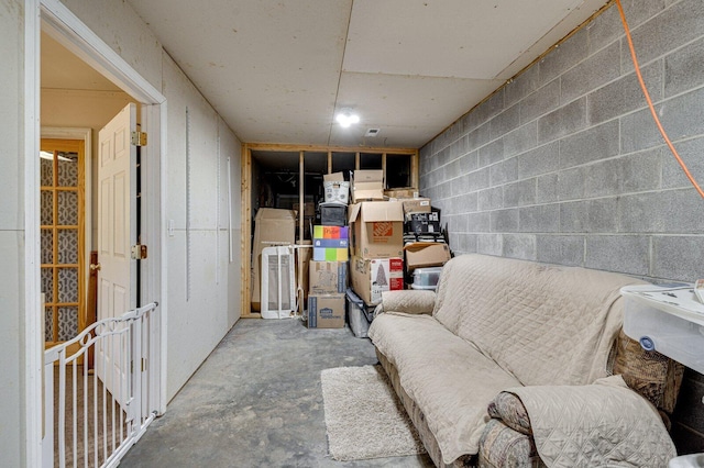 interior space with concrete block wall