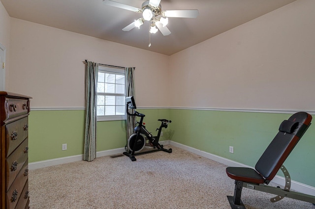 exercise area featuring baseboards, carpet flooring, and ceiling fan