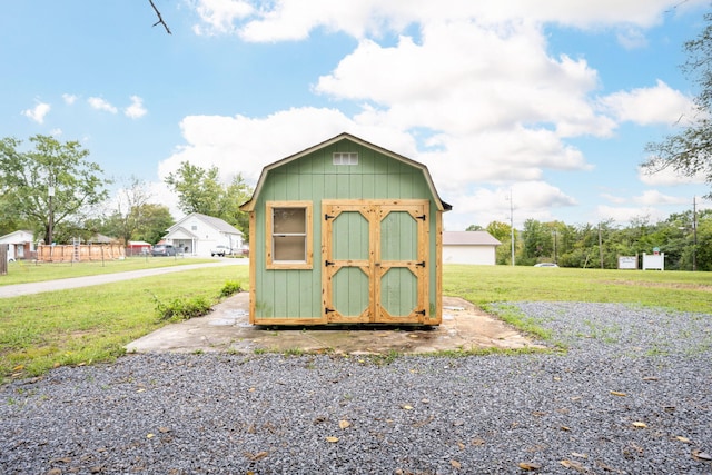 view of outbuilding with a lawn