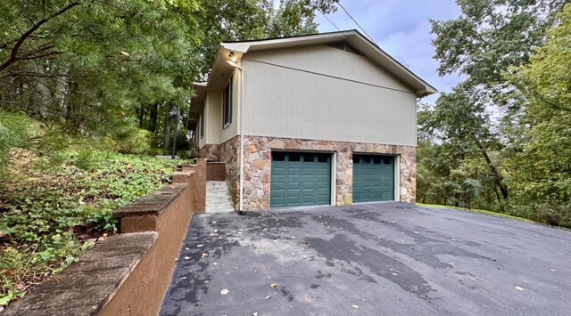 view of side of property with a garage