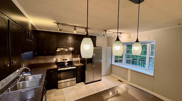 kitchen with pendant lighting, sink, a textured ceiling, appliances with stainless steel finishes, and dark brown cabinetry