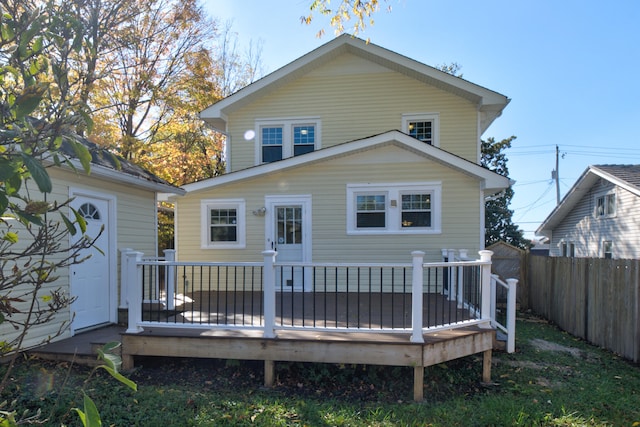 back of house featuring a deck