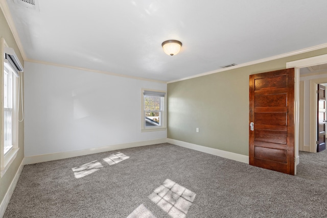 spare room featuring carpet floors and ornamental molding