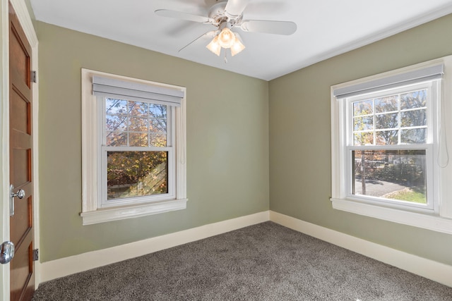 carpeted empty room featuring ceiling fan