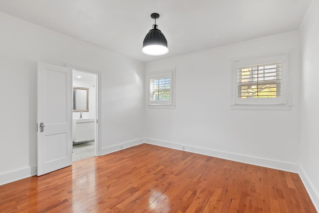 spare room featuring hardwood / wood-style flooring