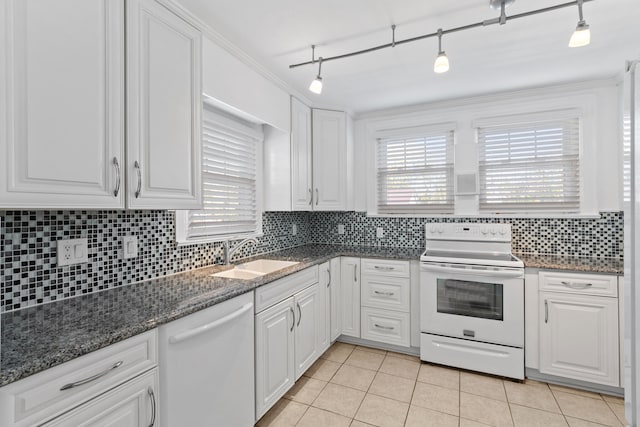 kitchen with white cabinets, white appliances, and sink