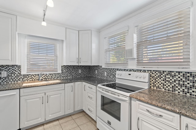 kitchen with white cabinets, white appliances, and sink