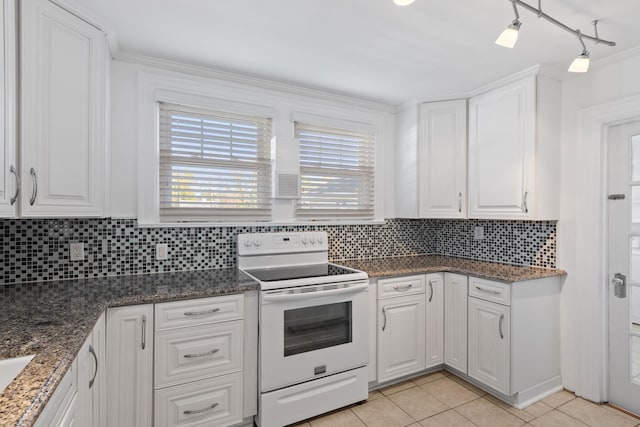 kitchen featuring electric stove, white cabinetry, and decorative backsplash