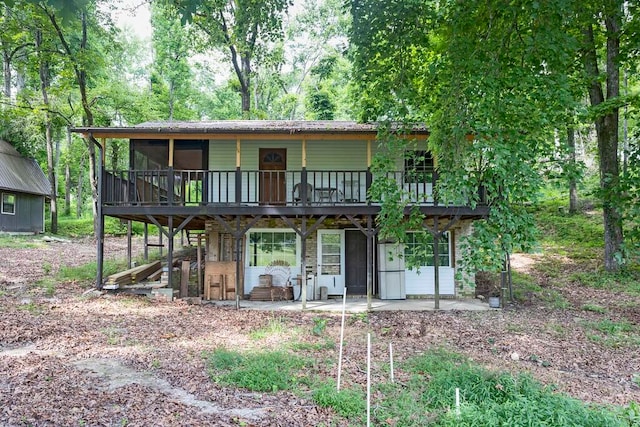 view of front of house with a patio and a wooden deck