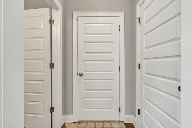 doorway to outside with baseboards