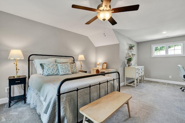bedroom with baseboards, carpet floors, a ceiling fan, and lofted ceiling