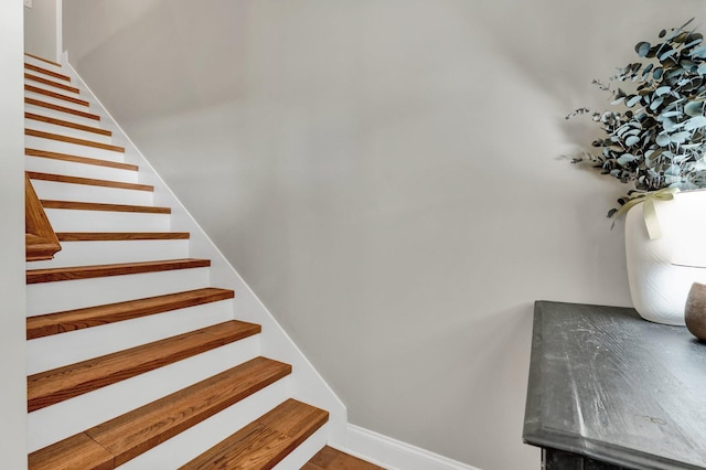 stairs featuring baseboards