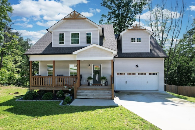 view of front of home featuring concrete driveway, a shingled roof, a garage, and covered porch