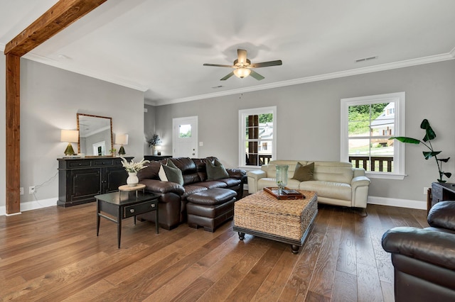 living area featuring dark wood-type flooring, a ceiling fan, baseboards, and ornamental molding