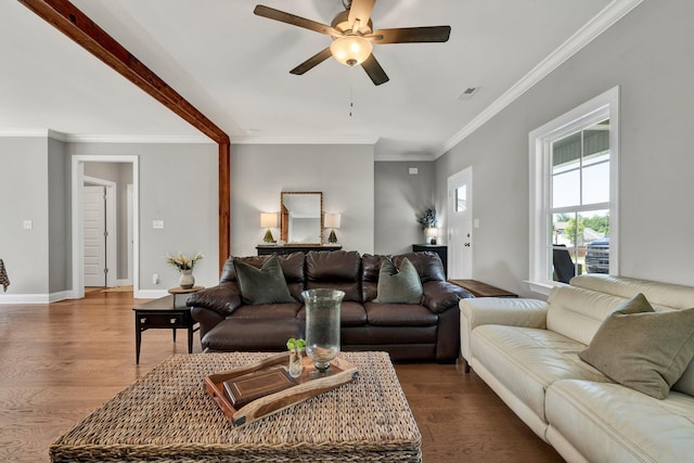 living room with a ceiling fan, ornamental molding, wood finished floors, and baseboards