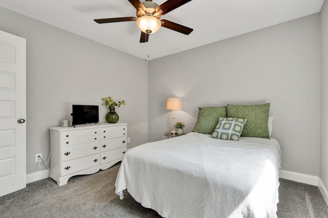 carpeted bedroom with baseboards and ceiling fan