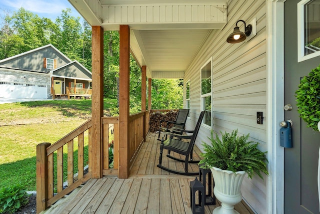 porch featuring a lawn