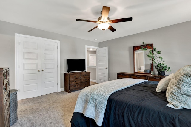 bedroom with carpet flooring, a closet, a ceiling fan, and baseboards