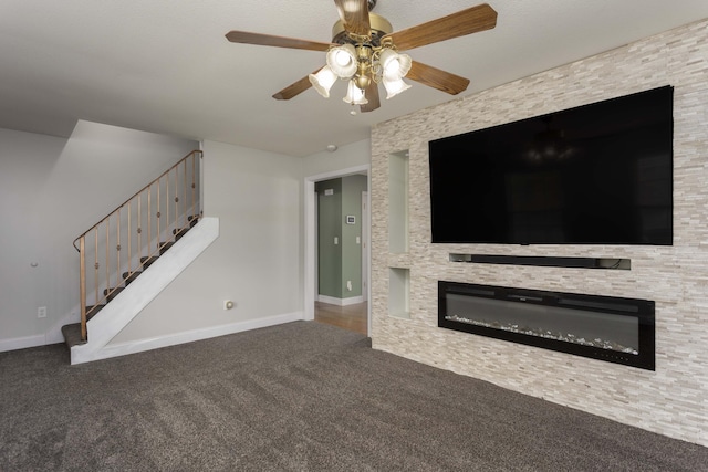 unfurnished living room featuring stairs, a fireplace, baseboards, and carpet floors