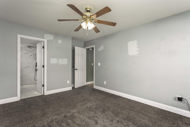 unfurnished bedroom featuring baseboards, carpet, ceiling fan, and ensuite bathroom
