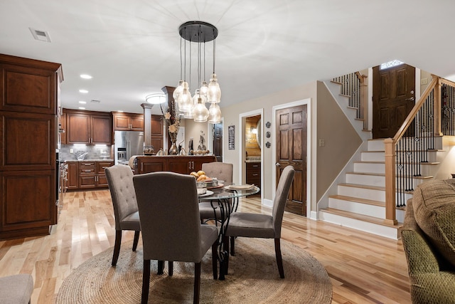 dining room with light hardwood / wood-style flooring