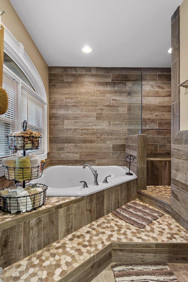 bathroom with tiled tub