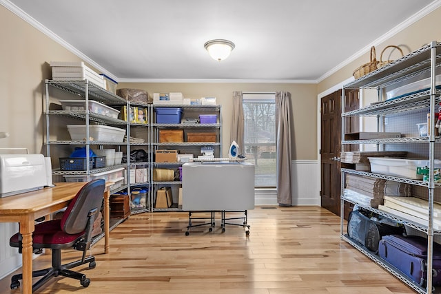 office featuring light wood-type flooring and ornamental molding