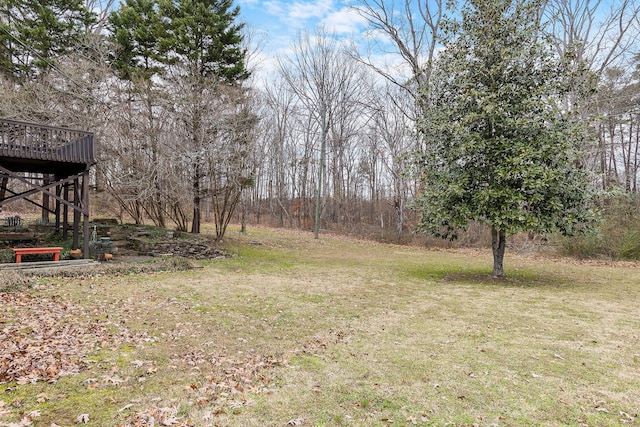 view of yard with a wooden deck