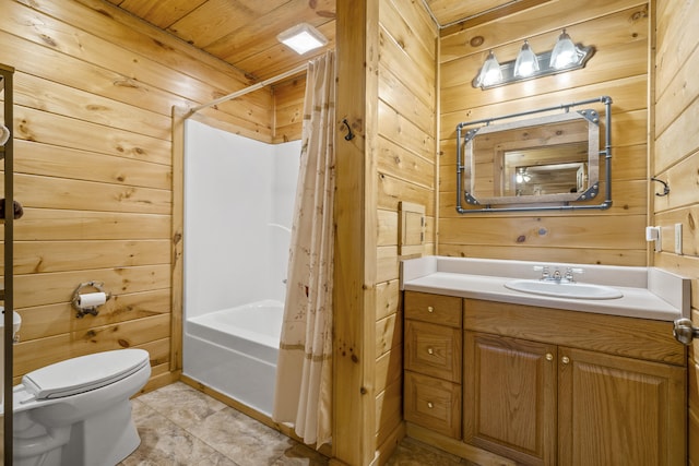 bathroom featuring shower / bath combination with curtain, wooden walls, toilet, and vanity